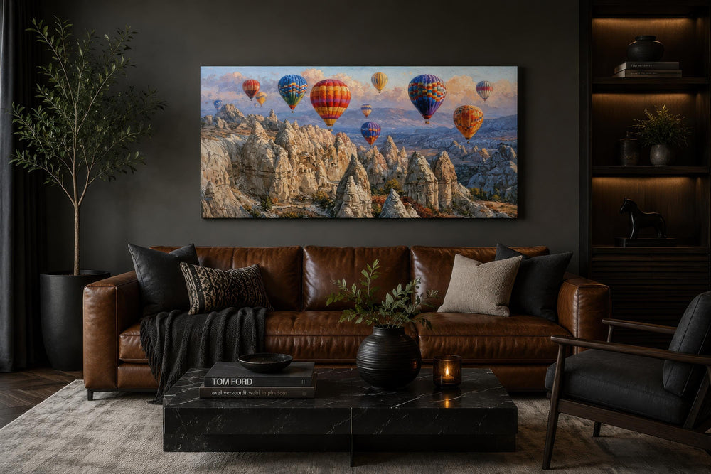 A wide horizontal canvas print of colorful hot air balloons over the Cappadocia landscape.