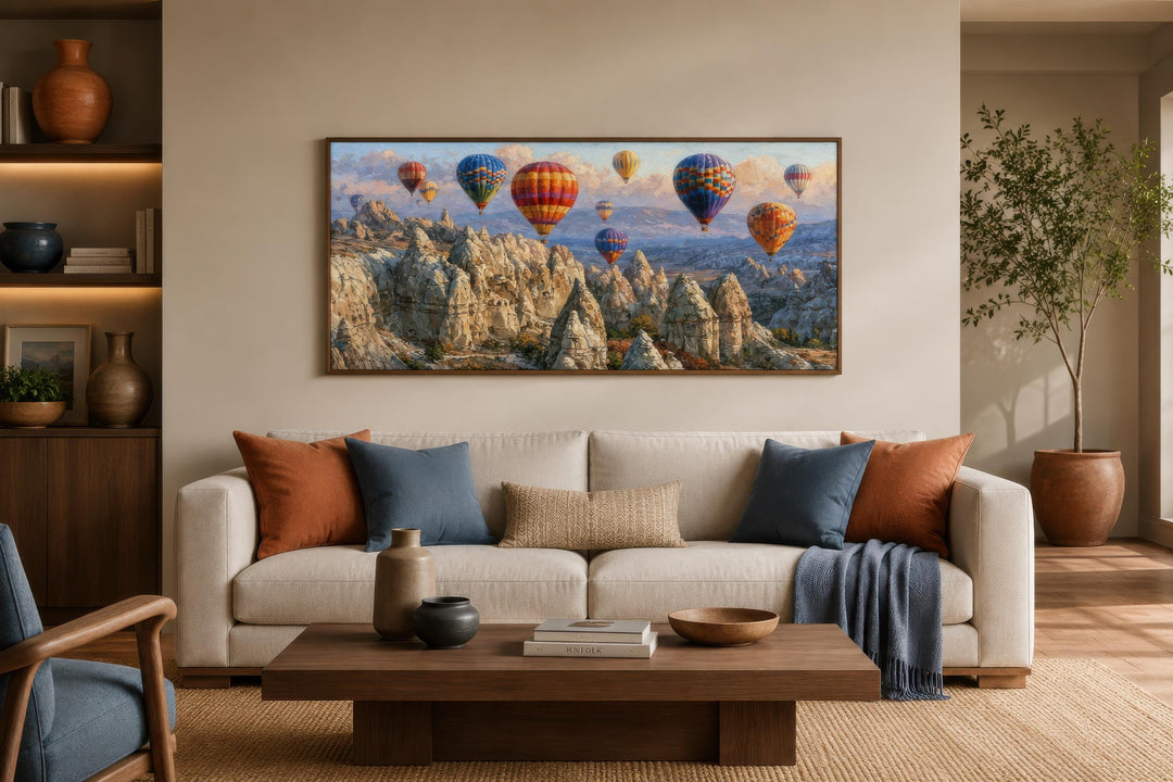 Panoramic Cappadocia canvas print featuring colorful hot air balloons over rocky fairy chimneys.