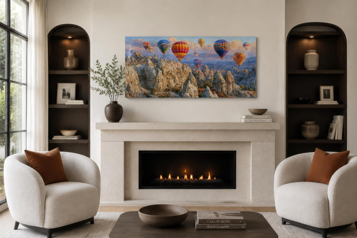 A panoramic canvas print of colorful hot air balloons over the Cappadocia landscape above a mantel.