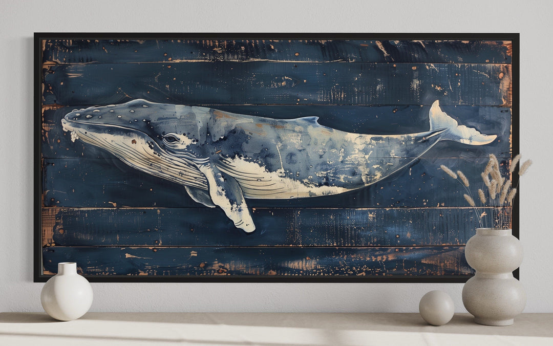 Humpback whale canvas wall art on navy blue distressed wood background with a black frame.