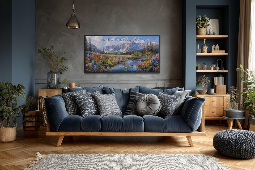 I Have Found The One Whom My Soul Loves scripture wall art above a blue sofa in a modern living room.