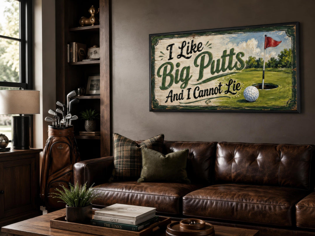 I Like Big Putts funny golf wall art hanging in a masculine man cave with a leather sofa.