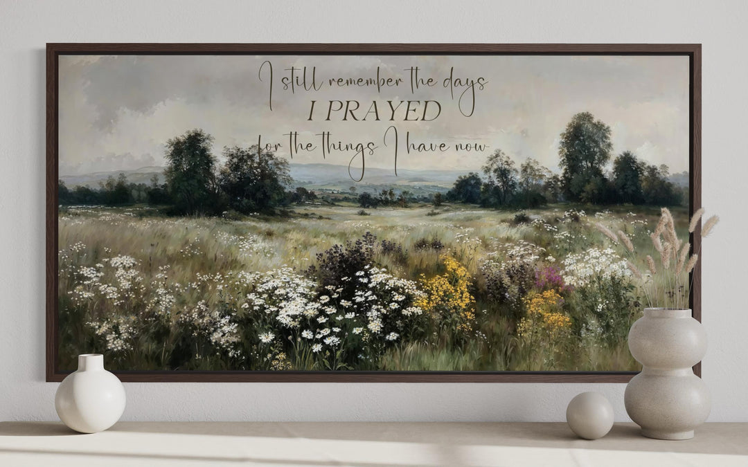 Large horizontal canvas wall art of a wildflower field with an inspirational Christian quote.