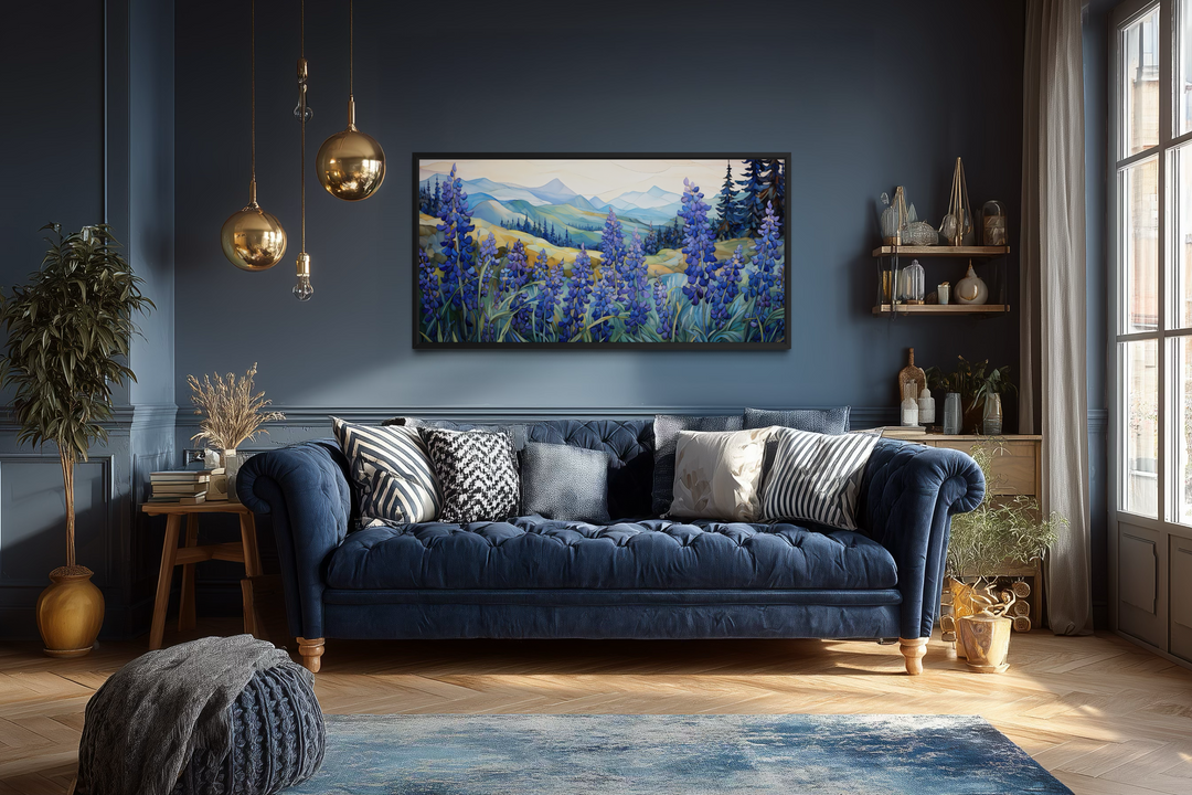 Framed canvas print of Texas bluebonnets in a field, hanging above a blue velvet sofa.