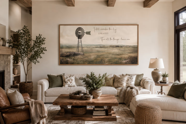 I Still Remember The Days wall art featuring a rustic windmill in a farm landscape above a sofa.