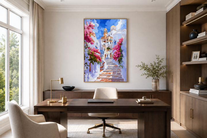 Ibiza Old Town watercolor wall art in a gold frame above a dark wood desk in a modern office.