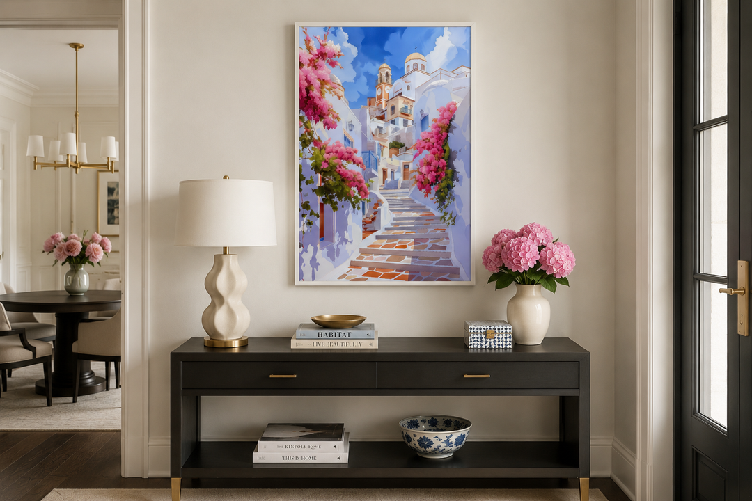 Ibiza Old Town watercolor wall art of a whitewashed street with pink flowers above a black console.