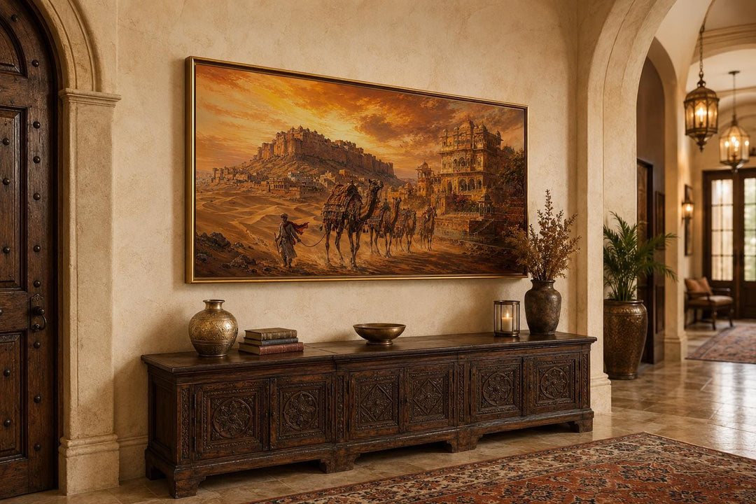 Indian camel caravan painting of a desert landscape with a hilltop fortress at sunset.