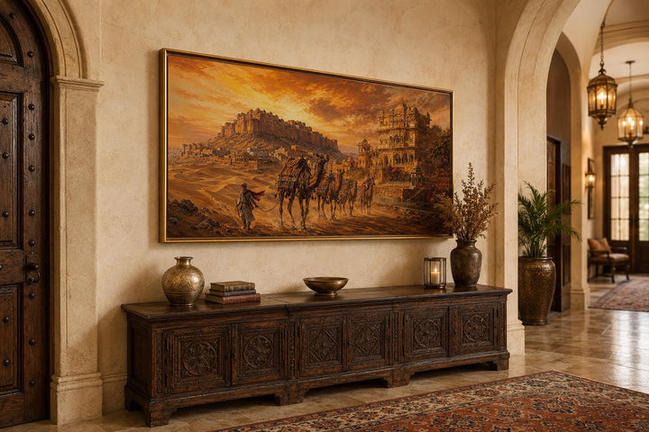 Indian camel caravan painting of a desert landscape with a hilltop fortress at sunset.