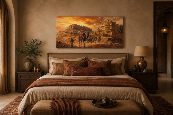 Indian camel caravan painting above a bed in a warm, desert-inspired bedroom with earthy tones.