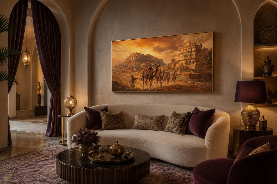 Indian camel caravan painting above a sofa, featuring a desert landscape and Rajasthan fortress.