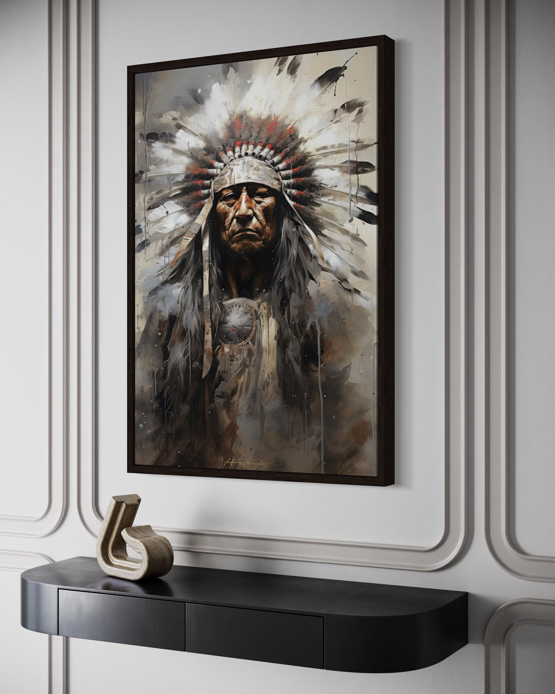 Framed canvas wall art of a Native American Indian chief in a headdress above a black console table.