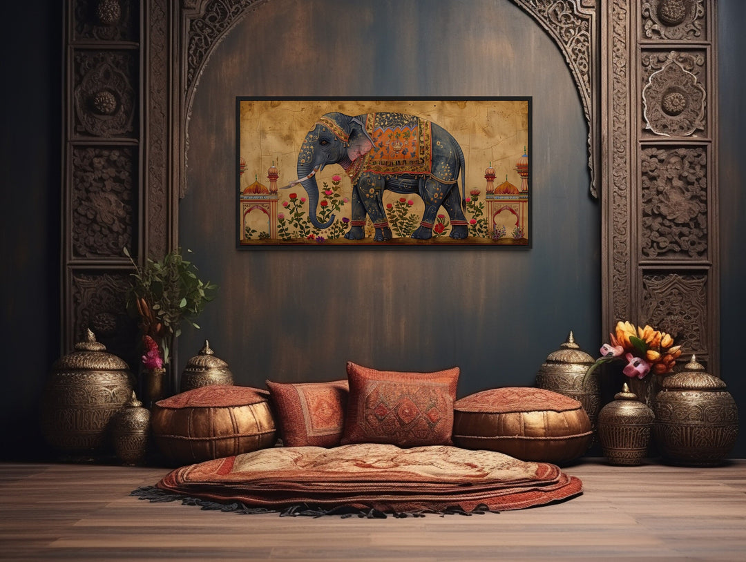 Framed canvas wall art of a decorated Indian elephant in a traditional, ornate room setting.
