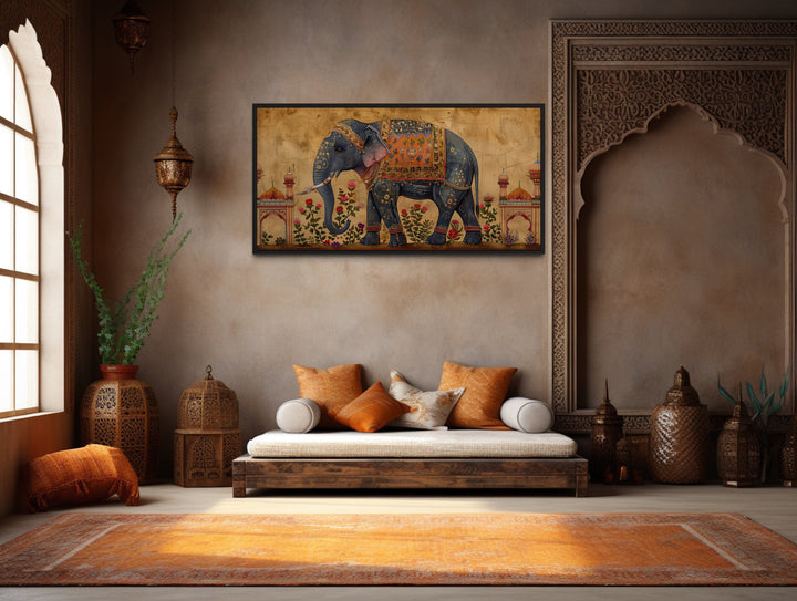 Traditional framed canvas wall art featuring an intricately adorned Indian elephant on a gold base.