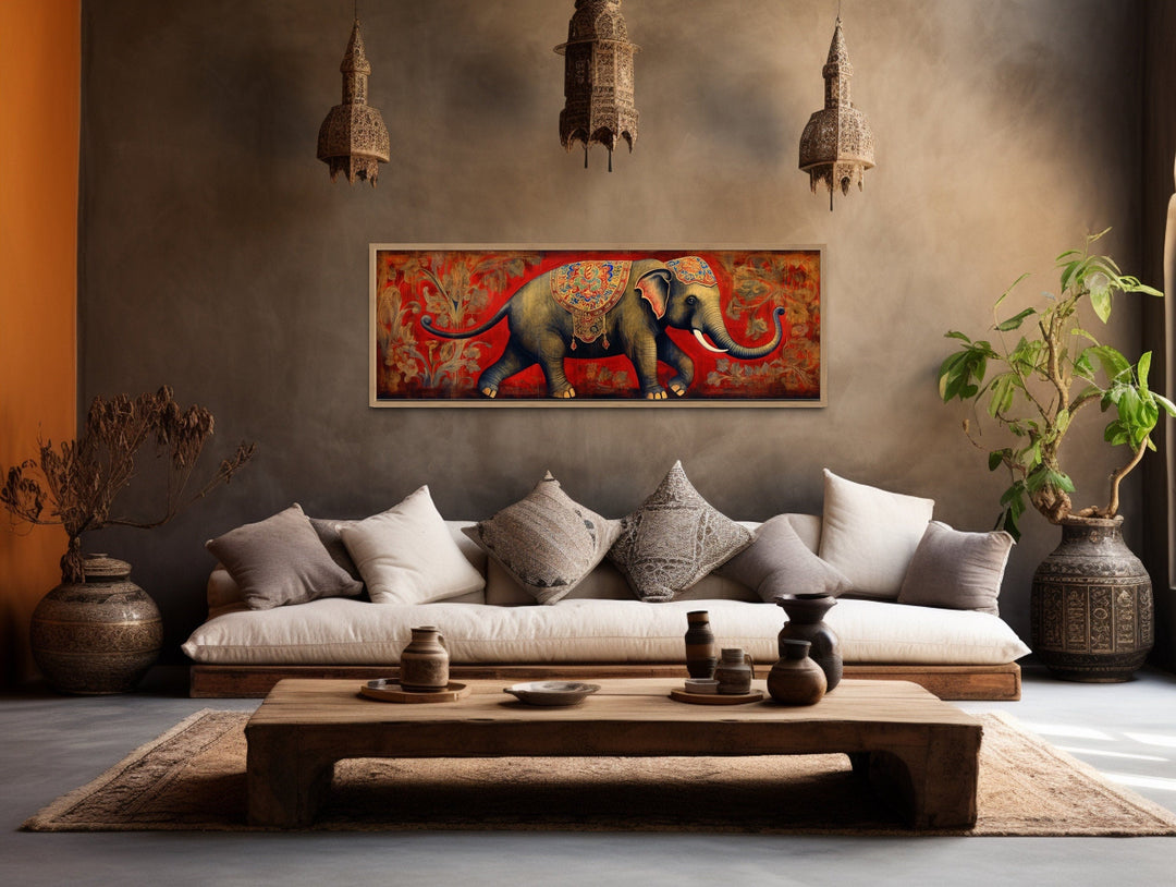 Panoramic framed canvas wall art of a traditional Indian elephant on a red background.