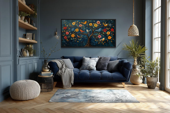 Madhubani Tree of Life canvas wall art featuring colorful birds and flowers on a dark blue background.