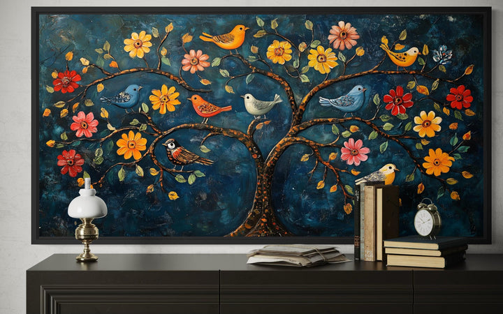 Madhubani Tree of Life canvas wall art featuring colorful birds and flowers on a dark blue background.