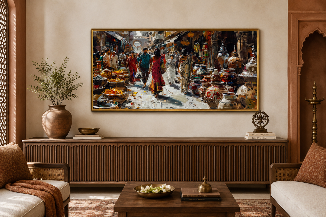 Framed Indian market painting on canvas above a wooden sideboard in a culturally styled living room.