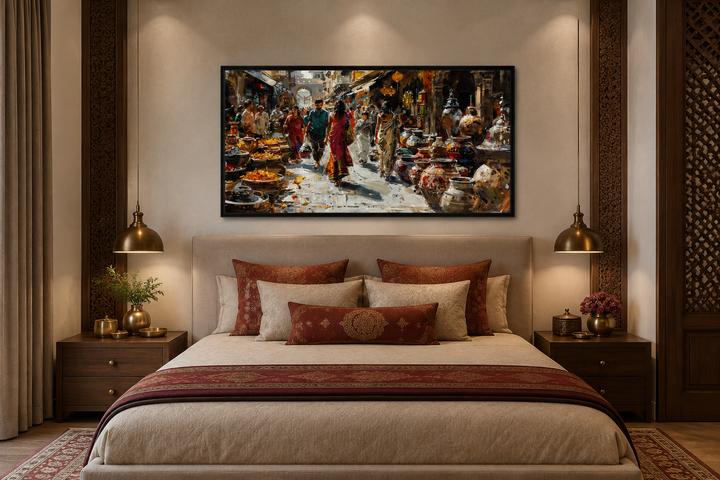 Framed canvas painting of a vibrant Indian market scene hanging above a bed in a bedroom.