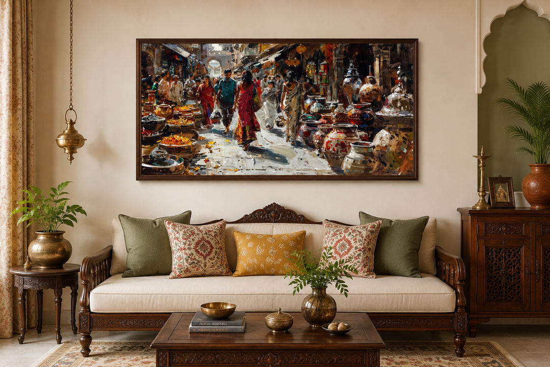 Framed canvas painting of a vibrant Indian street bazaar above a traditional wooden sofa.