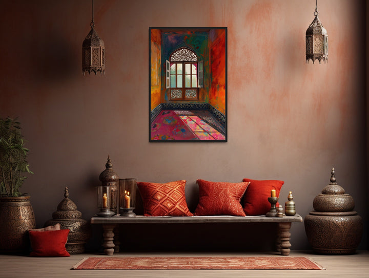 Framed canvas art of an ornate Indian window in a vibrant room, hung above a traditional bench.