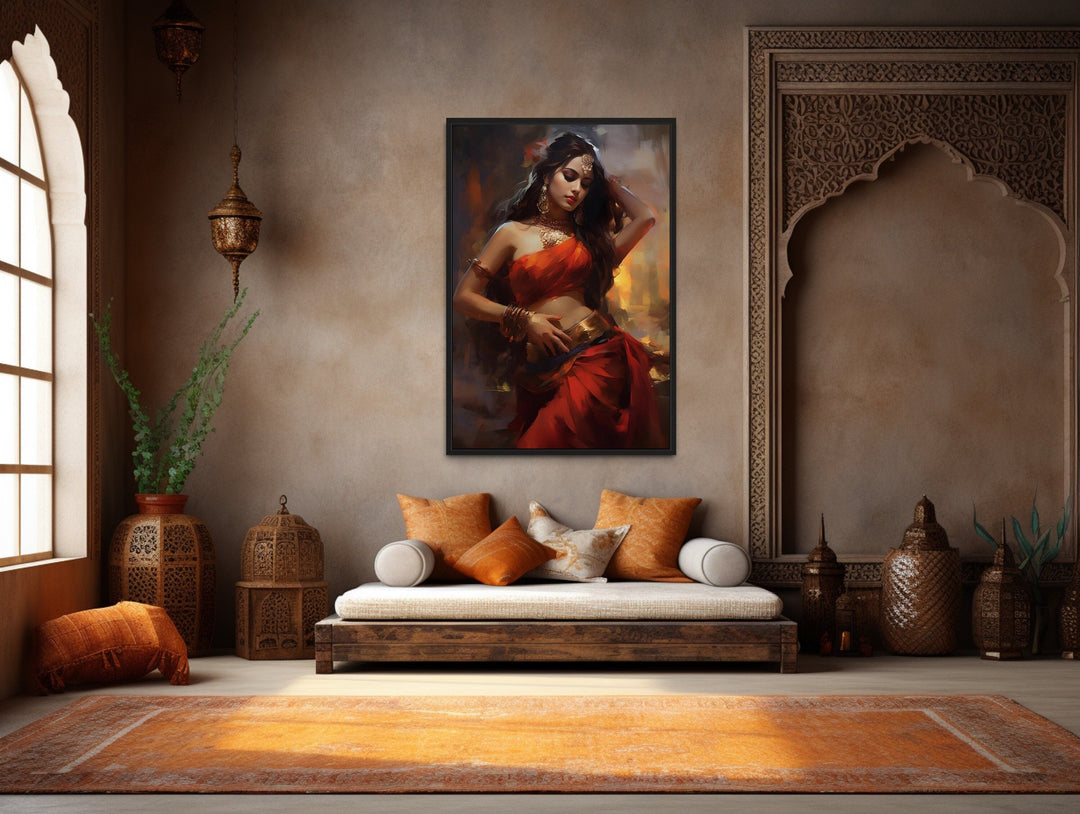 Framed canvas wall art of an Indian woman in a red sari dancing, hung in a bohemian living room.
