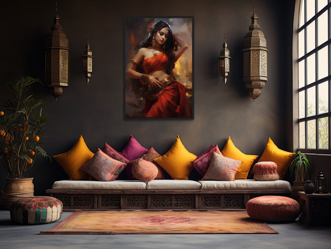 Framed canvas wall art of an Indian woman in a red sari dancing, hung in a bohemian living room.