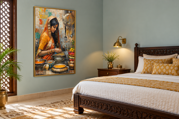 Indian woman cooking kitchen canvas wall art in a gold frame hanging in a bedroom.