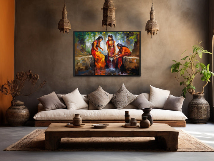 Indian Women At The Well traditional framed canvas wall art in a rustic living room setting.