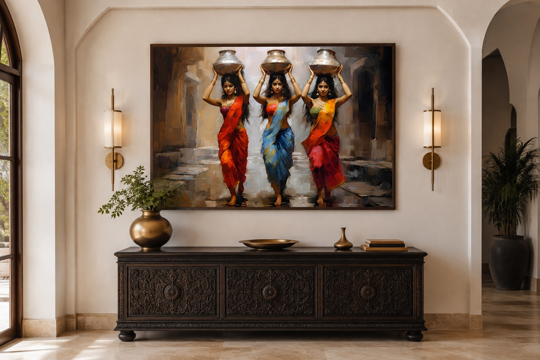 Indian women head carrying water pots framed canvas wall art above a dark wood carved sideboard.