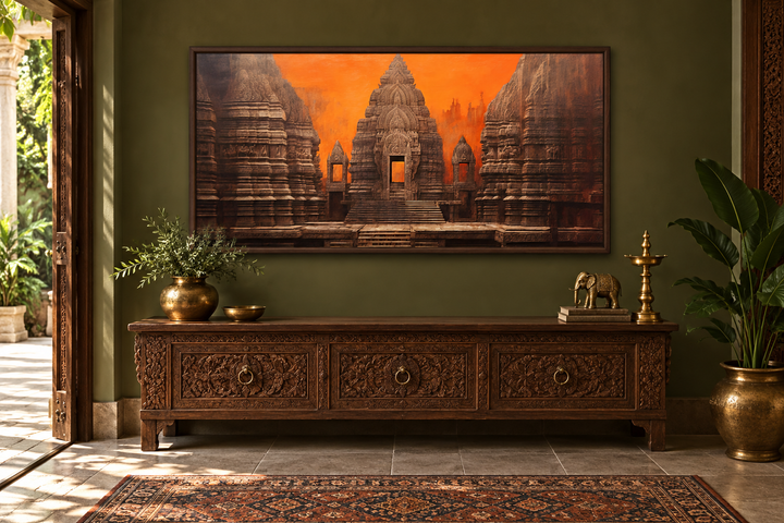 Framed Indian temple canvas wall art in orange and brown tones above a carved wooden sideboard.