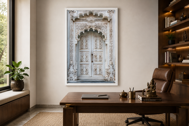 White and grey framed canvas wall art of an intricately carved traditional Indian door.