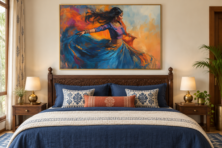 Framed canvas wall art of an Indian woman dancing in a blue dress above a bed in a bedroom.