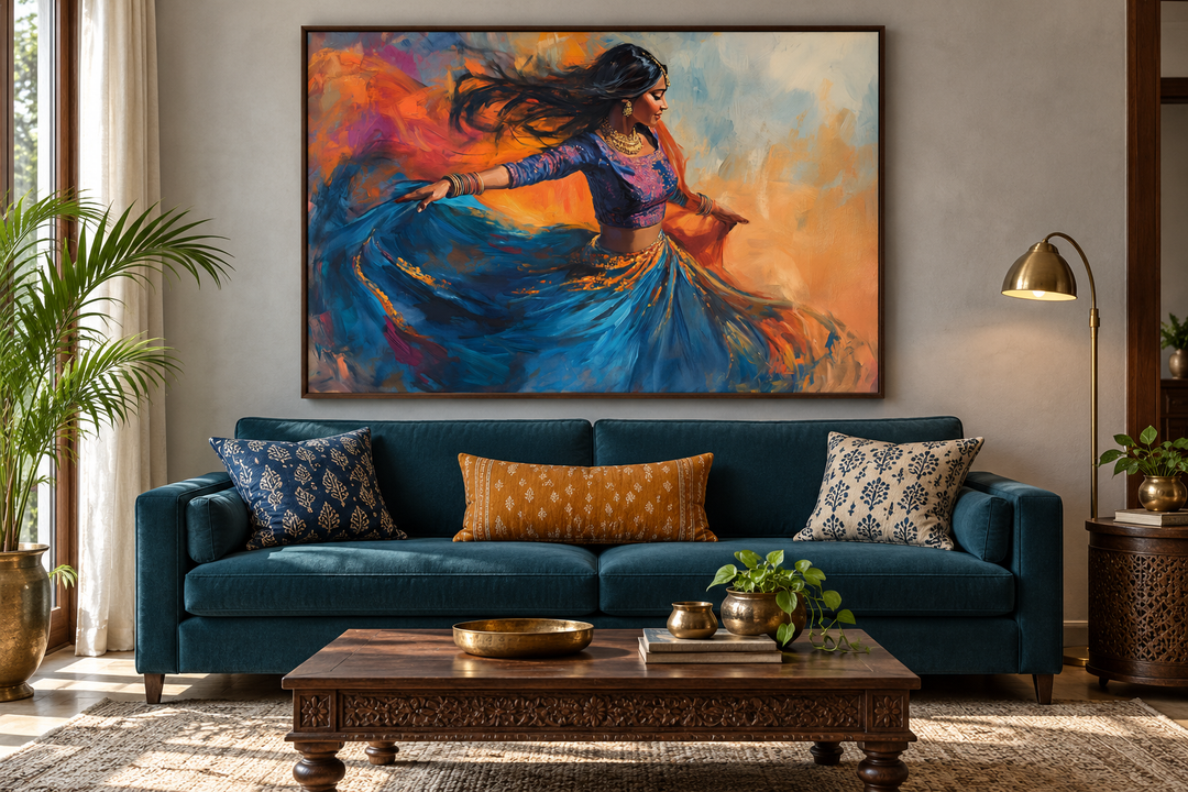 Framed canvas wall art of an Indian woman dancing in a blue dress over a teal sofa in a living room.