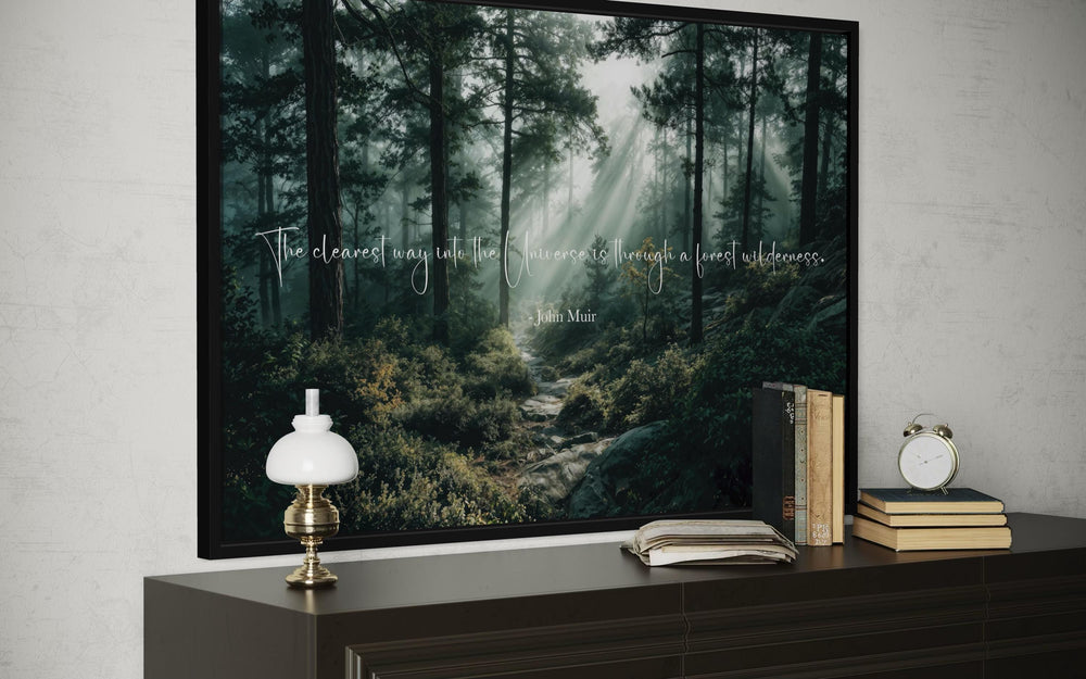 Inspirational John Muir quote canvas wall art featuring a misty forest with sunbeams.