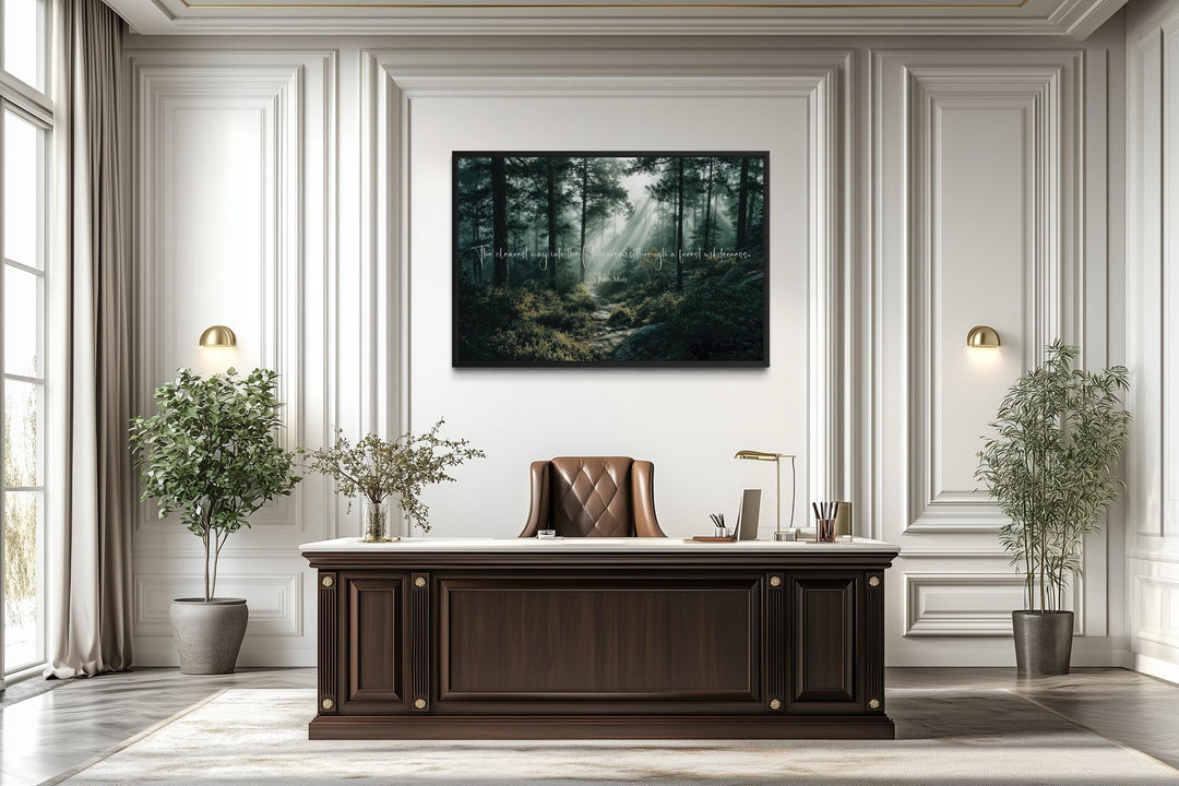 Inspirational John Muir quote canvas with forest wilderness wall art in a classic office setting.
