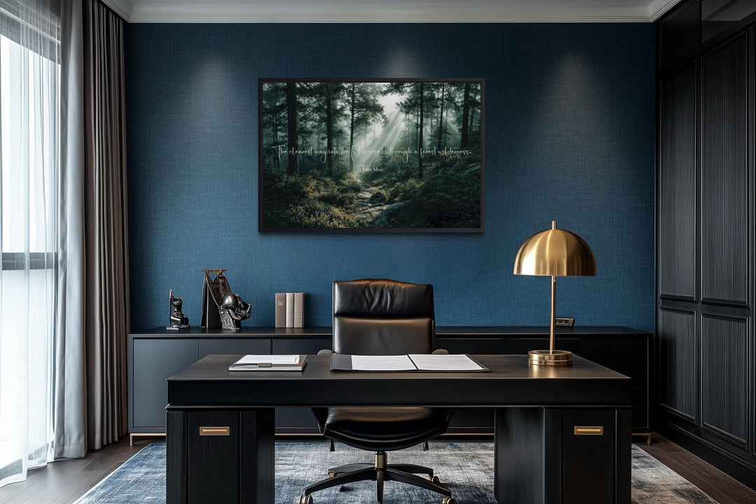 Inspirational John Muir quote canvas featuring a misty forest scene in a modern office setting.