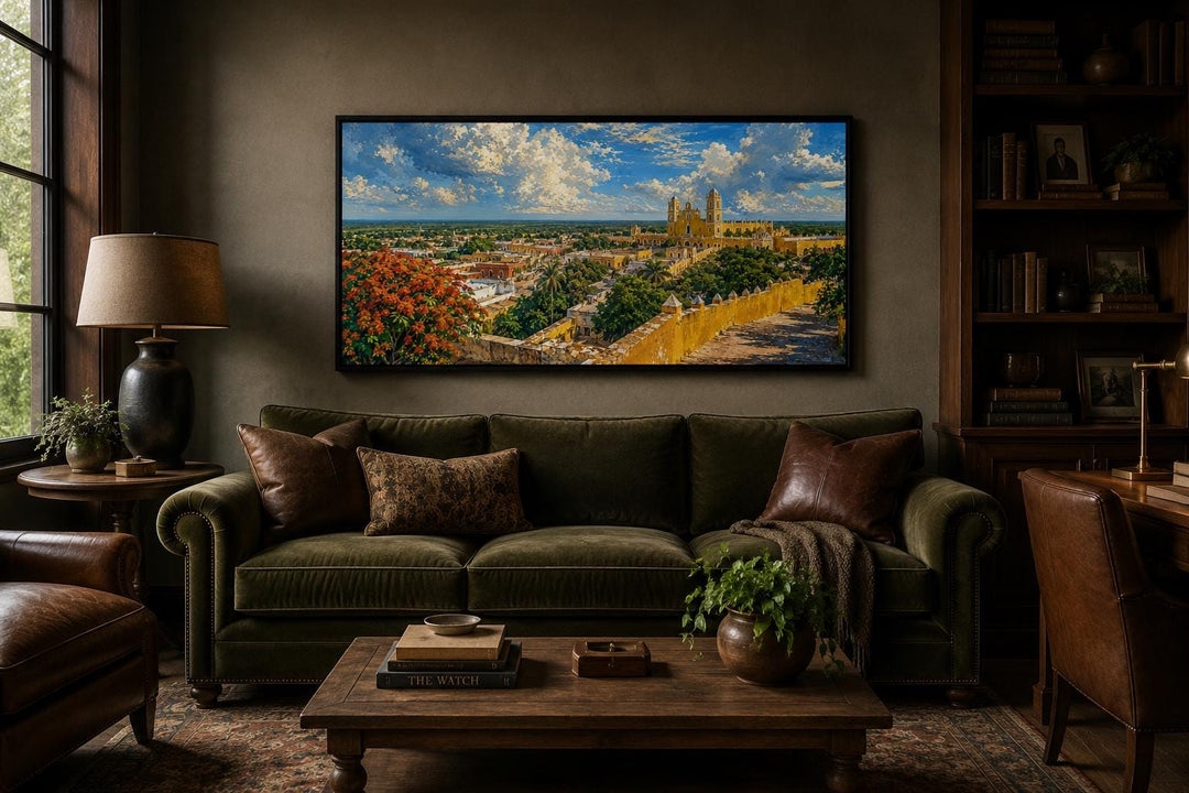 Izamal Cityscape canvas wall art featuring yellow colonial buildings above a green velvet sofa.