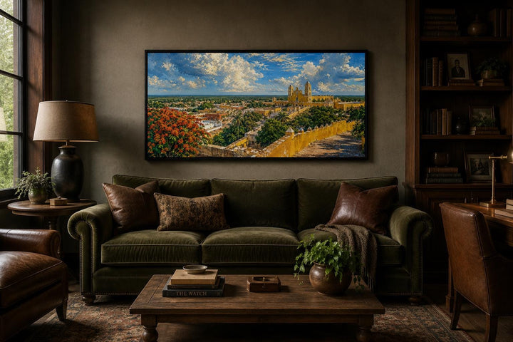 Izamal Cityscape canvas wall art featuring yellow colonial buildings above a green velvet sofa.