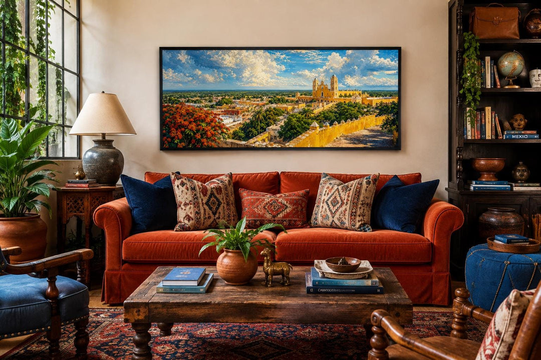 Izamal Cityscape canvas wall art featuring yellow colonial buildings above a burnt orange sofa.