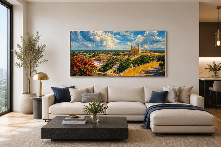 Izamal Cityscape canvas wall art with yellow colonial buildings above a modern sofa.