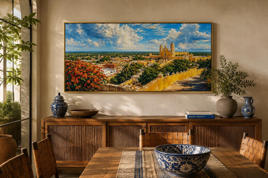 Izamal Cityscape canvas wall art featuring yellow colonial buildings above a wooden console table.
