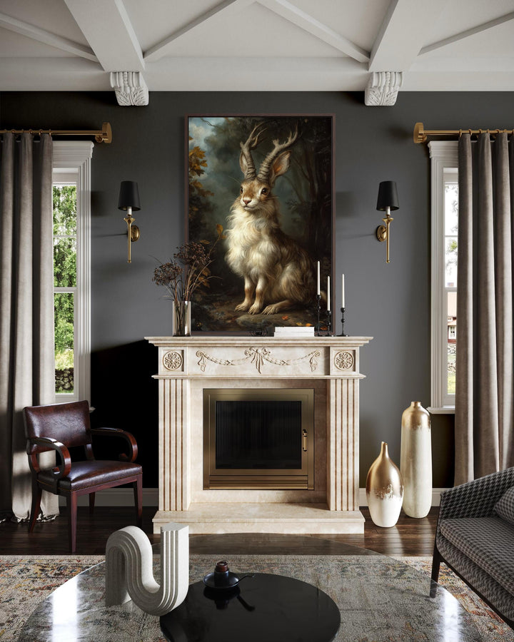 A majestic jackalope portrait on canvas hangs above a fireplace in a dark, moody living room.