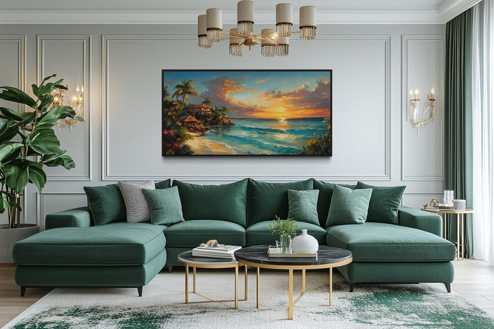Jamaican Sunset Beach Framed Canvas Wall Art displayed above a green sectional sofa in a living room.