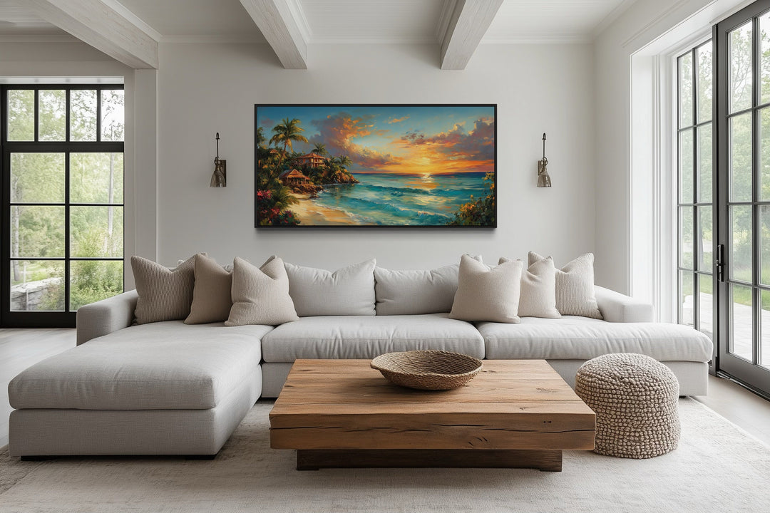 Jamaican Sunset Beach Framed Canvas Wall Art displayed above a sofa in a modern living room.