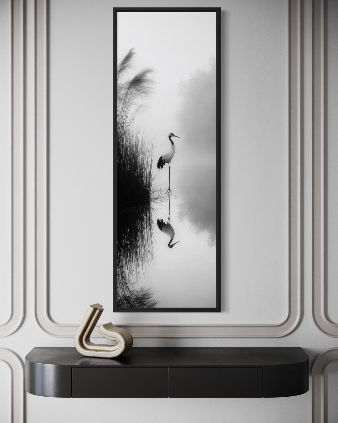 Vertical narrow canvas print of a Japanese crane in a black and white zen-style landscape.