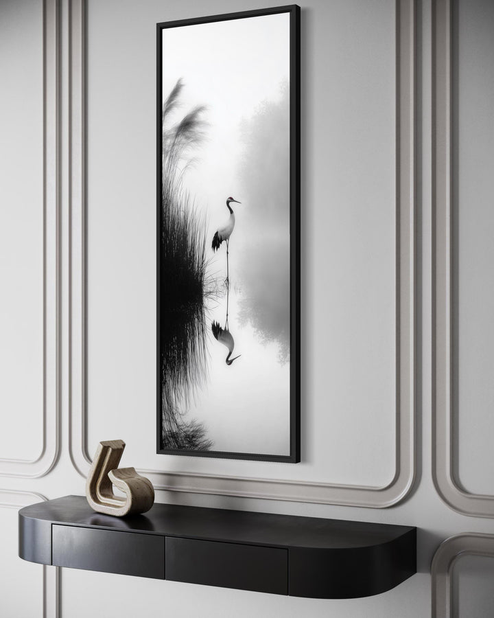 Vertical narrow canvas print of a Japanese crane in a black and white zen style on a paneled wall.