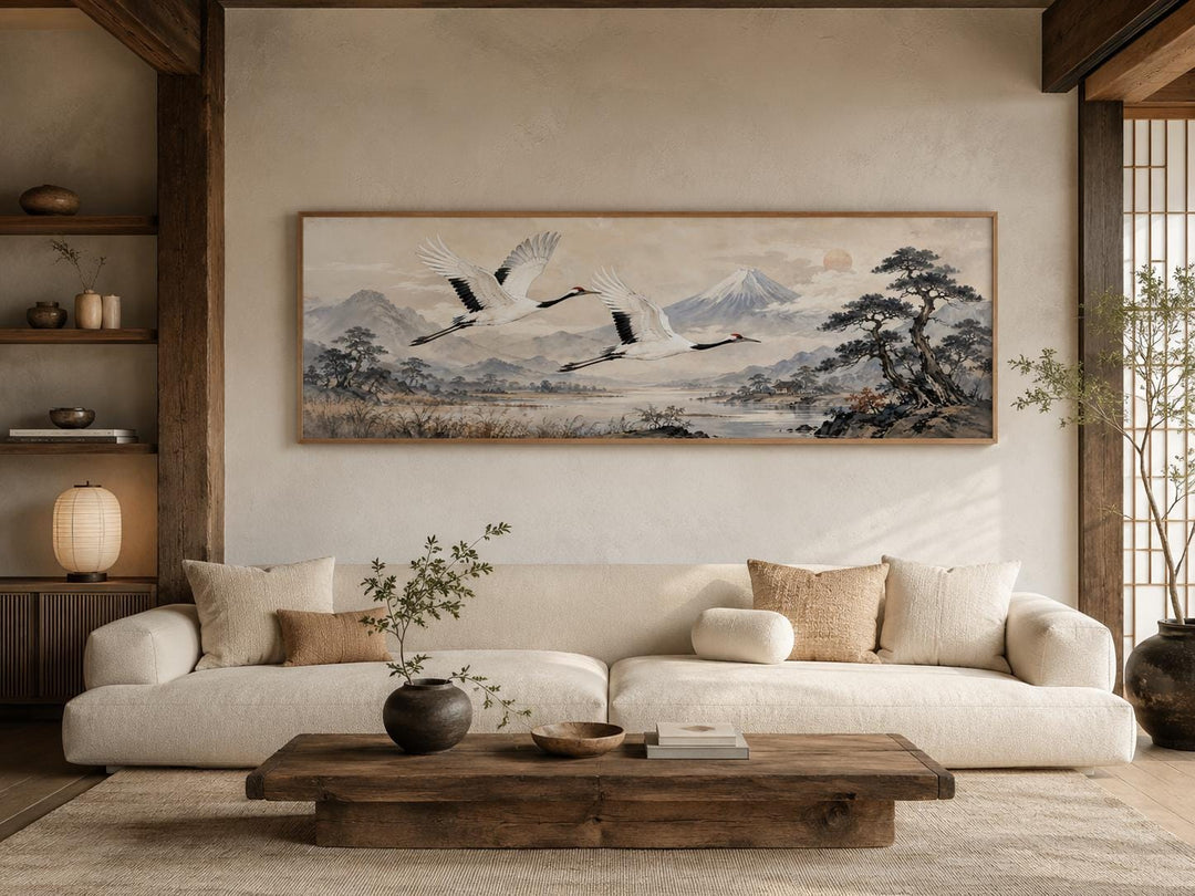 Japanese watercolor canvas of red-crowned cranes over misty mountains in a zen living room.