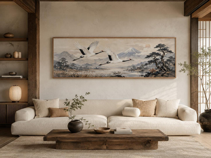 Japanese watercolor canvas of red-crowned cranes over misty mountains in a zen living room.
