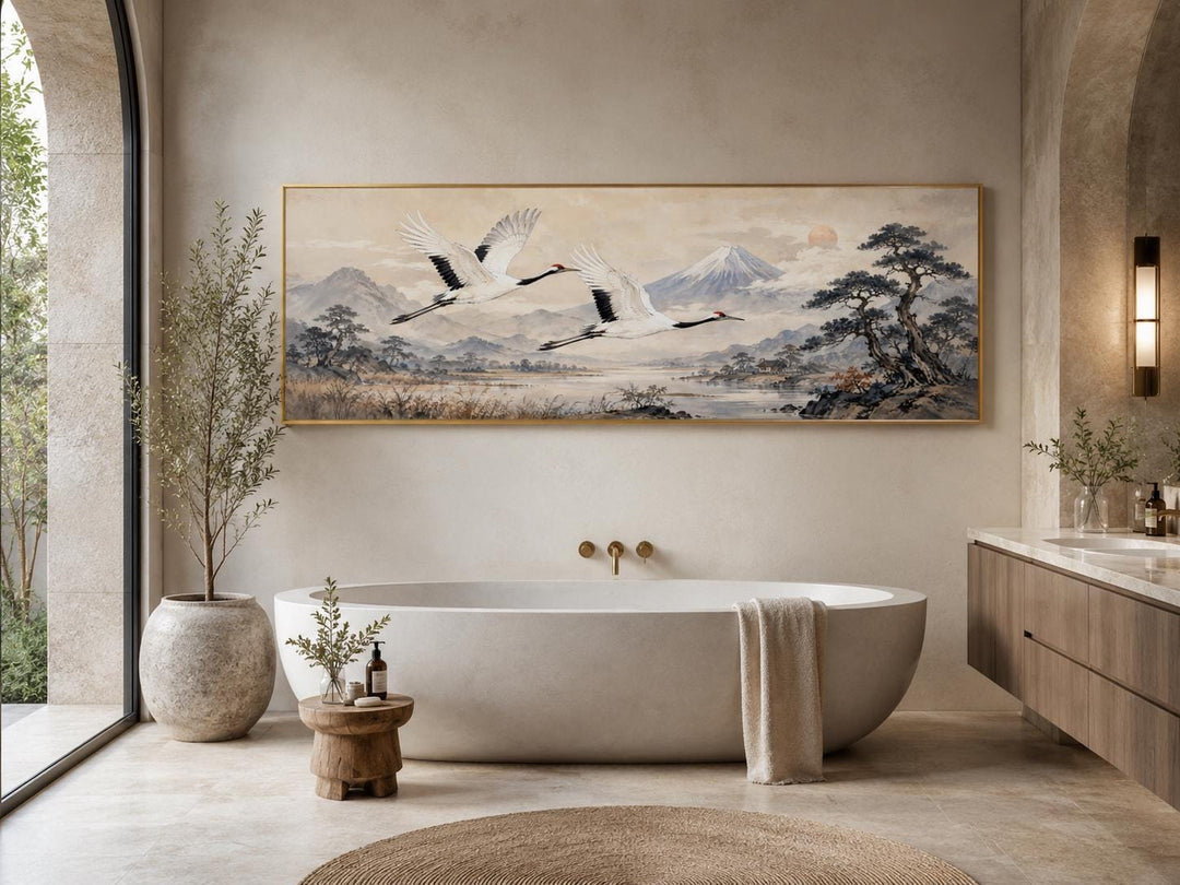 Japanese watercolor canvas of red-crowned cranes over misty mountains in a zen-style bathroom.